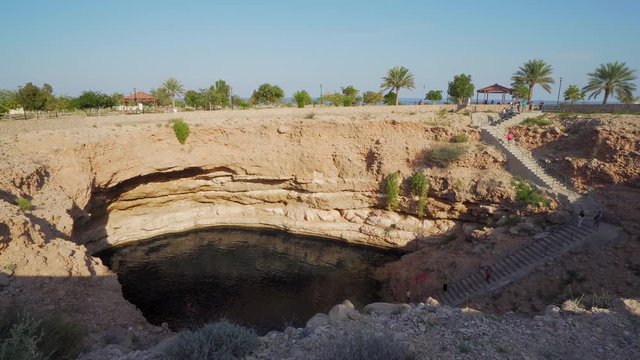 OMAN - JANUARY 3, 2020: Tourists Visiting Bimmah Sinkhole in Oman