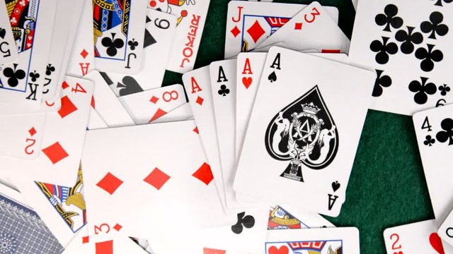 Aces Fall on Pile of Cards in Slow Motion