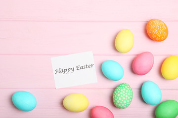 Easter eggs on the table top view. Easter composition with a place to insert text.