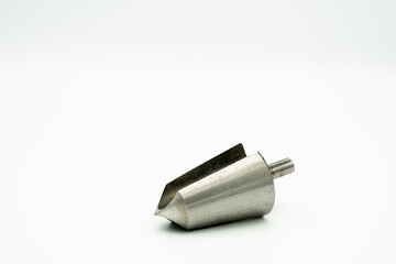 A countersink cutter lying on a white background