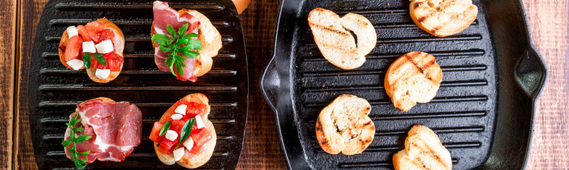 Banner of Toast on grill pan. Set of crostini