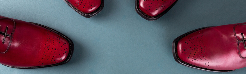 Banner of Red oxford shoes on blue background.