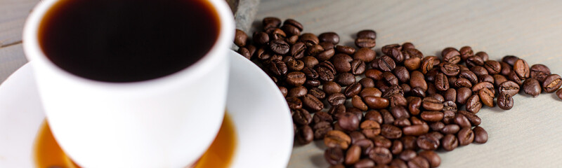 Banner of A White Cup of Hot Coffee in a Scattering of Coffee Beans