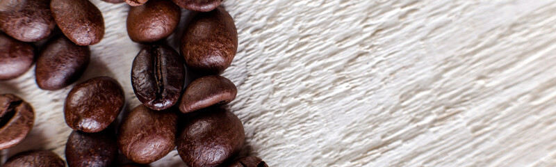 Banner of Coffee beans or grain on white wooden background.