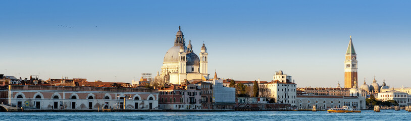 Long horizontal BANNER. Cityscape of Venice at sunset. City buildings on the water.