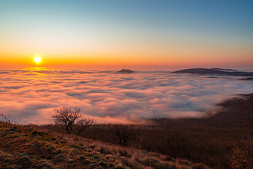 beyond the foggy sky on mountain in sunset nature
