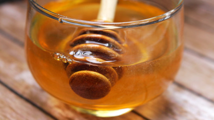 Honey is nutritious for health, stirring with a honey spoon 