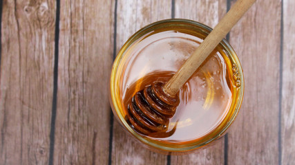 Honey is nutritious for health, stirring with a honey spoon 