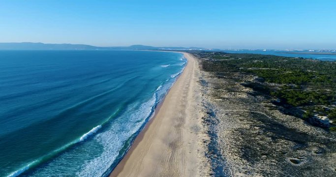 Aerial view of the Comporta Beach and the Troia Peninsula with the Arrabida Mountain on the background, in Portugal