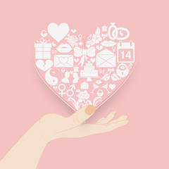 Icons of Valentines day in the shape of a heart are shown on a female hand. Pink tender background concept for greeting card, invitation or banner