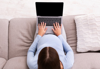 Expectant Woman Typing On Laptop Sitting On Couch, Mockup, Top-View