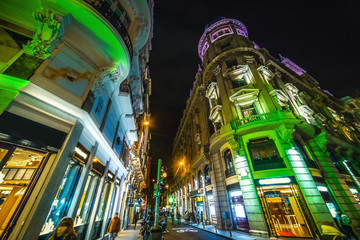 Colorful facades in Gran Via boulevard in Madrid at night