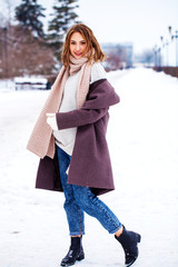 Portrait of a young beautiful woman in a winter coat