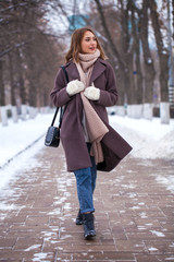 Portrait of a young beautiful woman in a winter coat