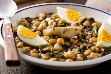 Chickpea stew with spinach and cod or potaje de vigilia. Typical spanish food for Easter holidays.