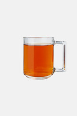 Glass mug with tea on a white background. Isolate.