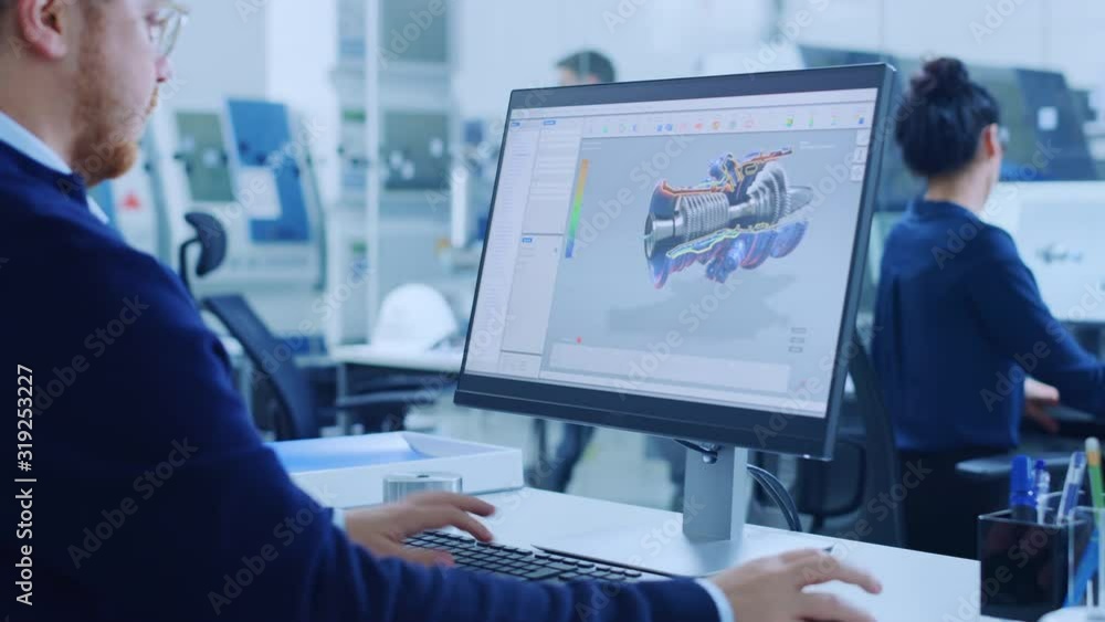 Poster Over the Shoulder: Heavy Industry Engineer Working on Personal Computer, Screen Shows CAD Software with 3D Prototype of Electric Engine