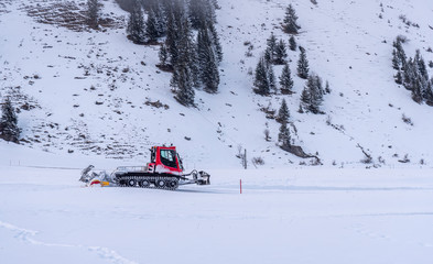 snow groomer in the alps