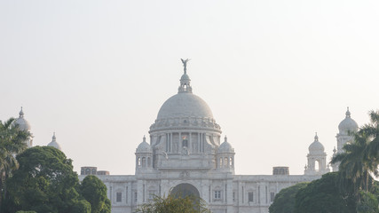 Obraz premium The Victoria Memorial main building, an iconic infrastructure of the old Imperial British occupied Indian era, a museum and tourist destination and heritage place. Kolkata, West Bengal, India May 2019