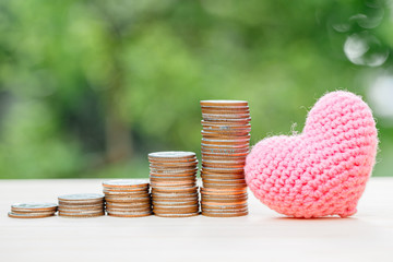 lovely heart with money coin stack for love to saving or keeping money business profit or medical...