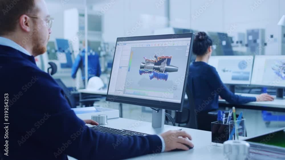 Aufkleber Over Shoulder: Heavy Industry Engineer Working on Personal Computer, Screen Shows CAD Software Showing New Generation Electric Engine. Industrial Factory with High-Tech CNC Machinery