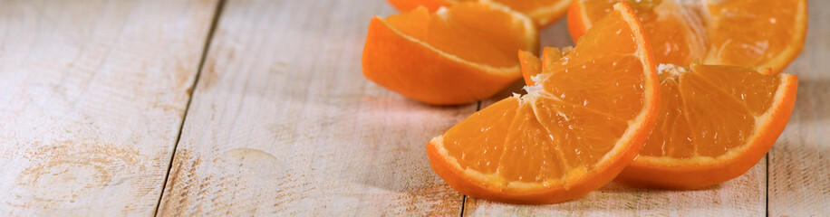 Fototapeta na wymiar image of orange slices on wooden board close-up