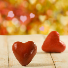image of stylized two red hearts on wooden boards as a symbol of love and fidelity