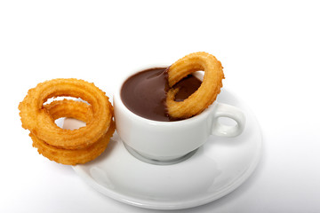 Cup of chocolate sauce with churros