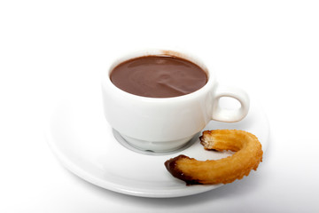 Cup of chocolate sauce with churros