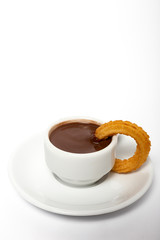 Cup of chocolate sauce with churros