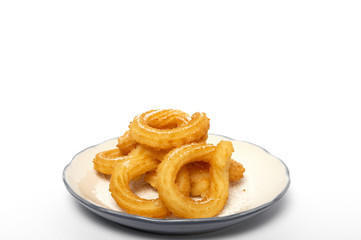 Cup of chocolate sauce with churros