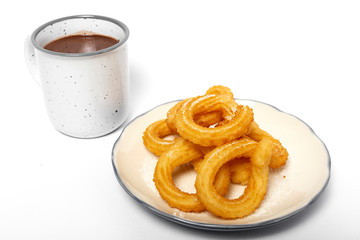 Cup of chocolate sauce with churros