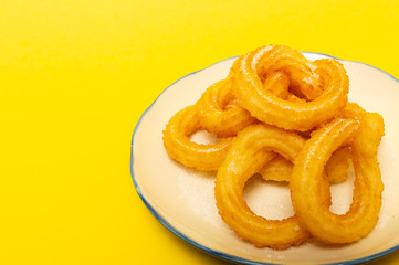 Cup of chocolate sauce with churros