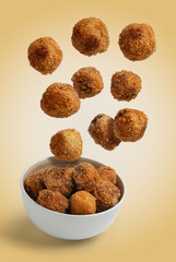 Homemade croquettes flying isolated background