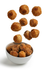 Homemade croquettes flying isolated background