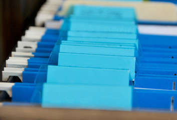 office file folders in blue in file cabinet