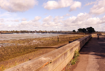 Fototapeta na wymiar A view north from Hayling Island, England, towards the bridge and the village of Langstone 