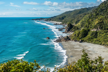Panoramic view on a shore with beach and rocks