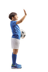 Football boy with a soccer ball gesturing high five