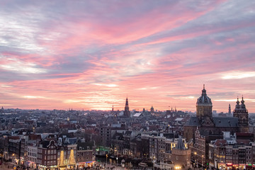 Fototapeta na wymiar Pink winter sunset overlooking the Amsterdam Netherlands skyline