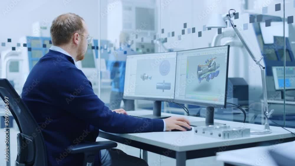 Poster Male Industrial Engineer Solving Problems, Working on a Personal Computer, Two Monitor Screens Show CAD Software with 3D Prototype of Hybrid Electric Engine Being Tested. Working Modern Factory