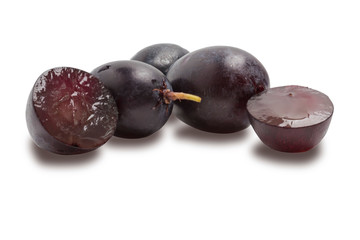 several pitted grapes isolated against a white background