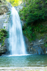 Fototapeta na wymiar Amazing Small Water Fall falling from Mountain. Himalayan Range
