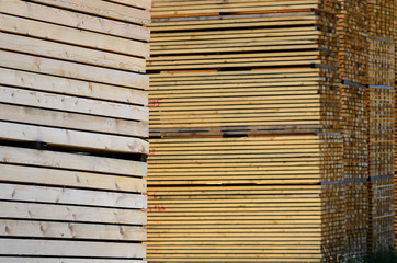 worked wooden boards stacked in a sawmill near Brunico. south tyrol, italy.
