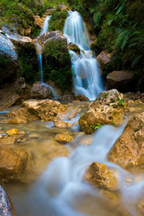 Amazing Small Water Fall falling from Mountain. Himalayan Range