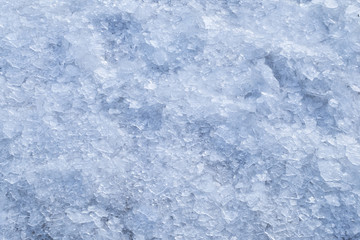 Fototapeta na wymiar Broken crushed ice fresh cold white winter snow background