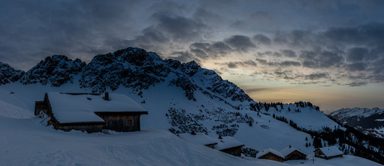 Evening mood in a lonely mountain hut in the Austrian Alps, summit of the Breithorn in the...