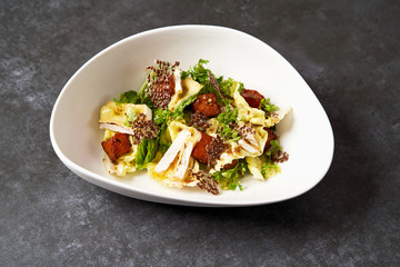 Baked Pumpkin salad with baked cheese, parsley herbs, white cabbage