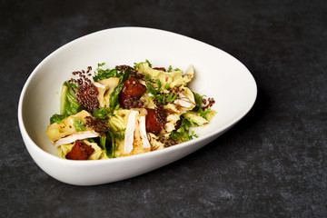 Baked Pumpkin salad with baked cheese, parsley herbs, white cabbage