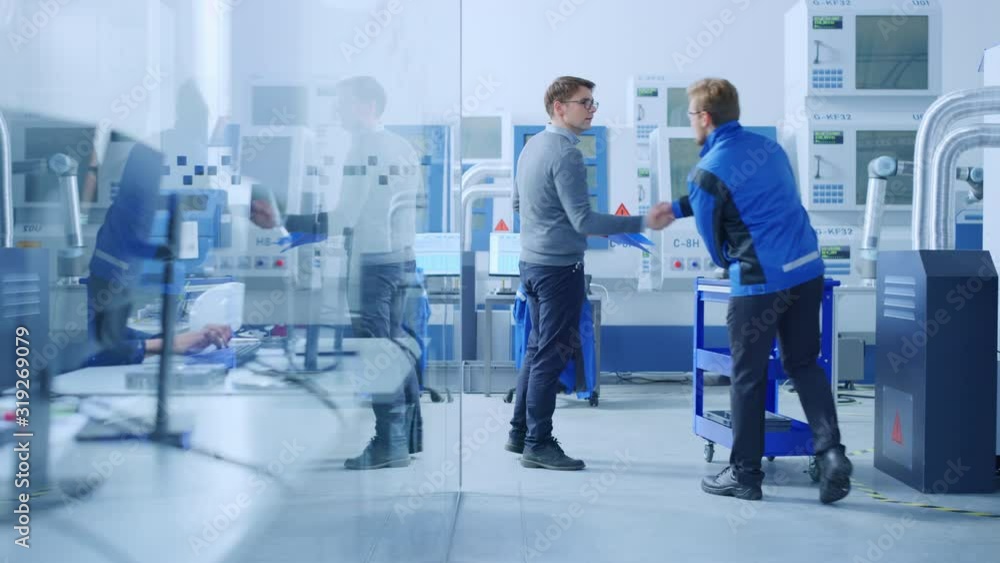 Fototapete inside factory glass office team of industrial engineers working on pc, outside cubicle in the moder